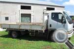 Mitsubishi Canter dropside truck with tradie bars